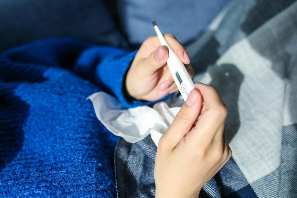 person looking at thermometer